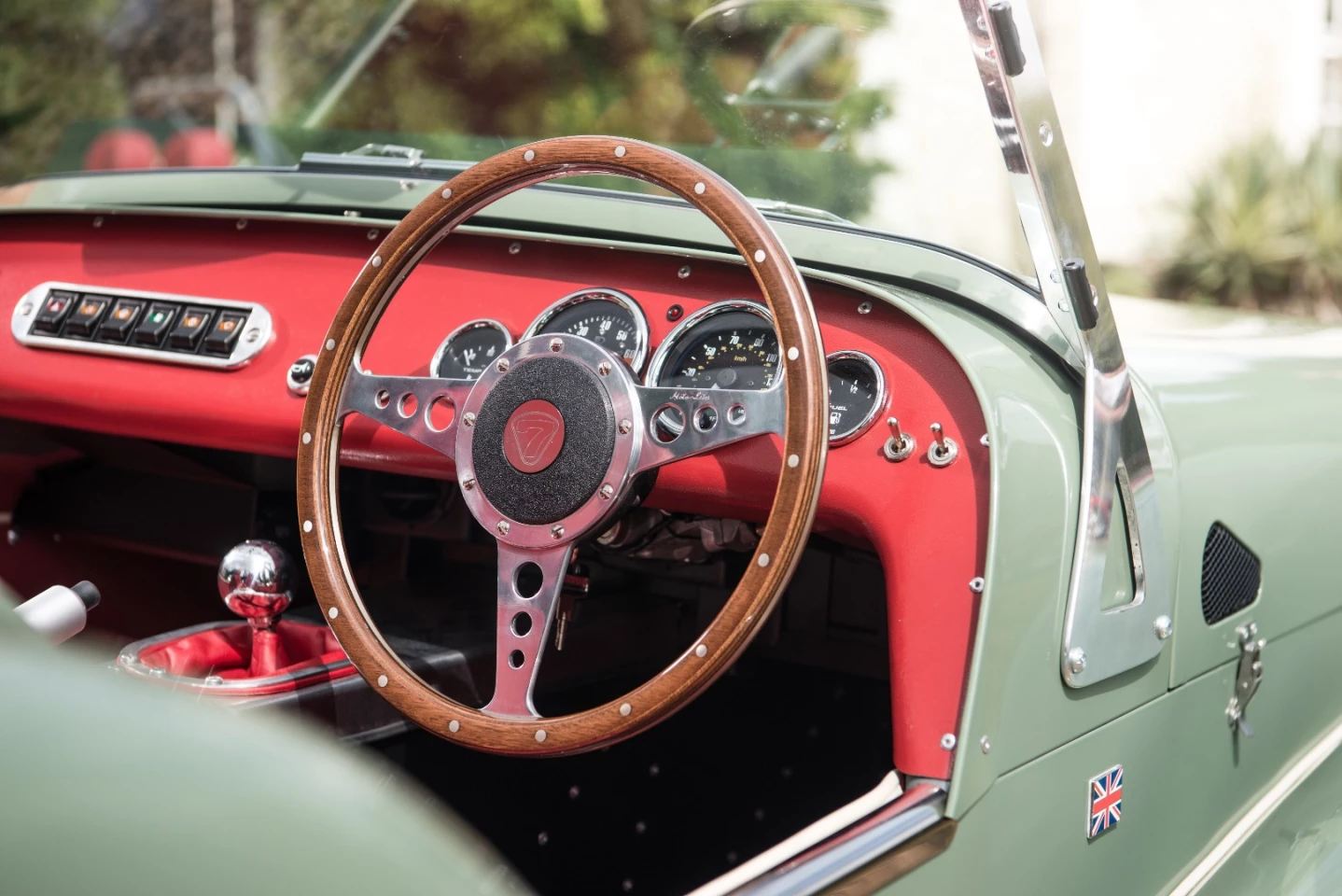 The wood rimmed steering wheel is a lovely throwback touch