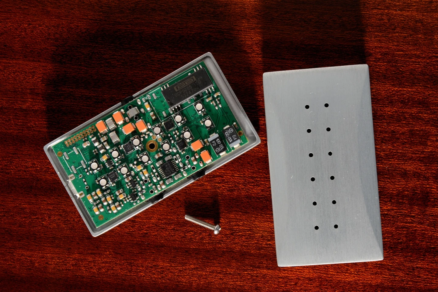 The aluminum housing acts as a heat sink to help cool the top shelf audio circuitry within