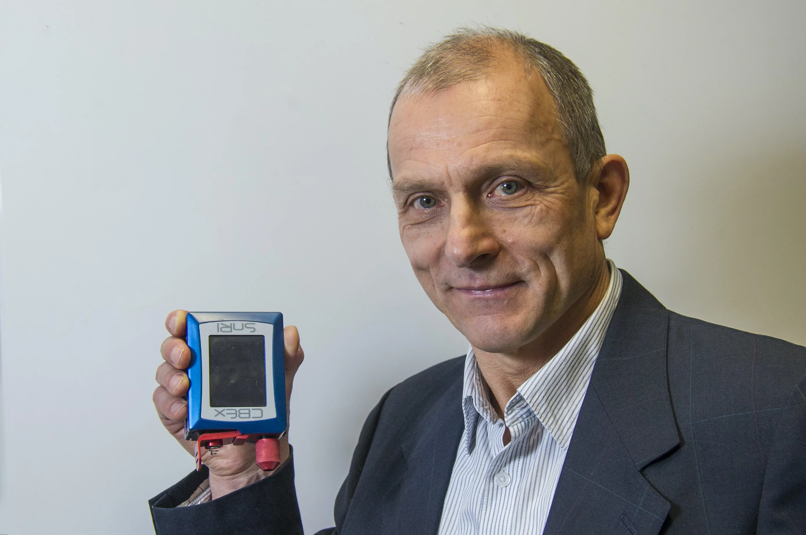 Prof. Igor Lednev with a portable Raman spectrometer – the device that he's creating would likely be similar in form