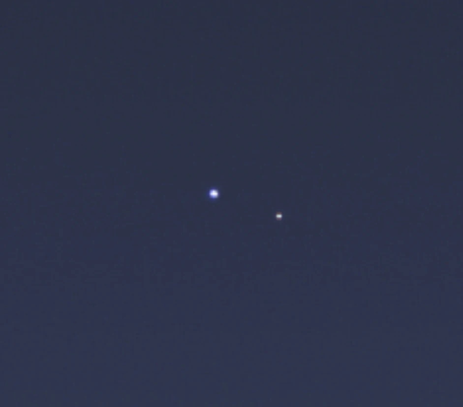 A zoomed crop of the image shows the Earth and Moon as distinct objects (Image: NASA/JPL-Caltech/Space Science Institute)