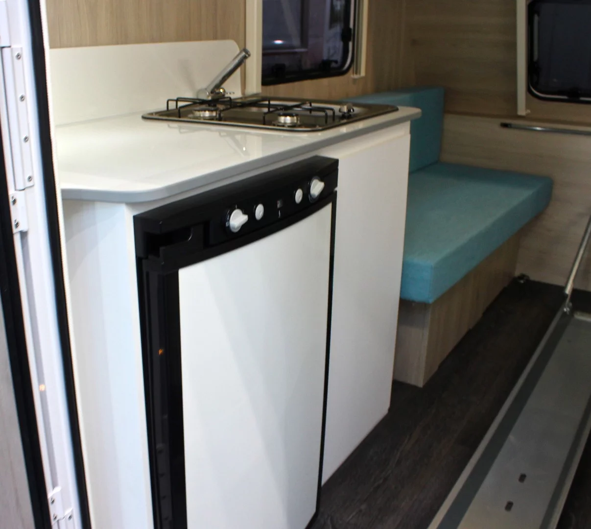 The Trigano Mini Freestyle 270's compact kitchen block packs everything you need - a dual burner stove, sink and 85-L fridge