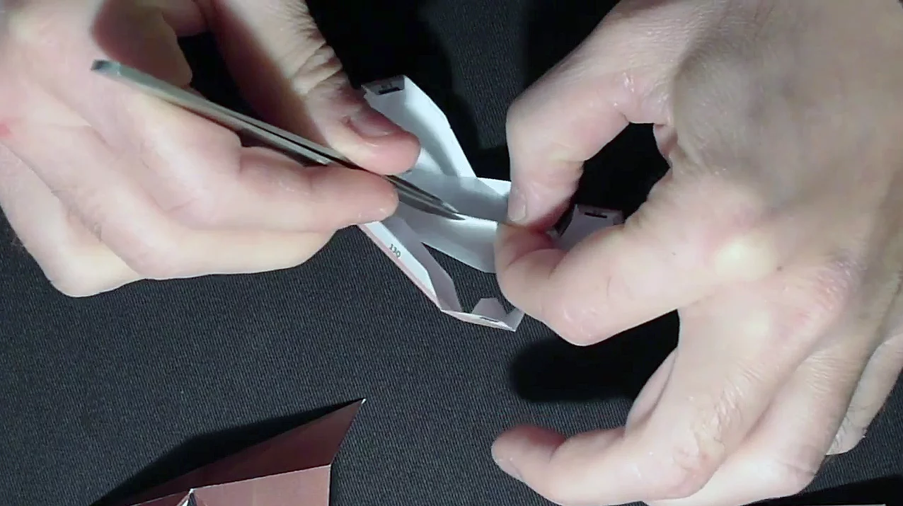 Assembly requires glue and staples, and may require the use of tweezers to hold the pieces together