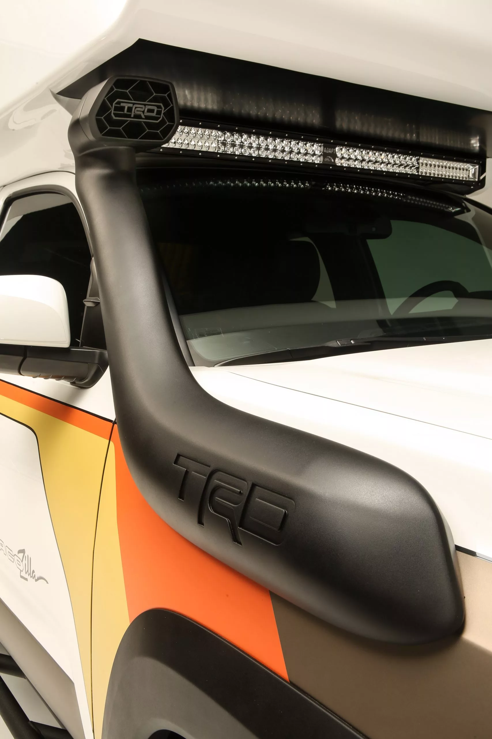 A TRD snorkel helps the Tacozilla breathe through the water (or look cool on the floor of SEMA)