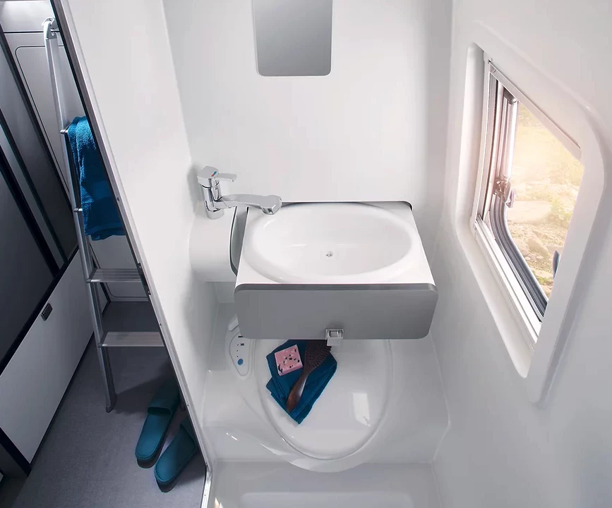 The Alphavan wet bath features a slide-out drawer sink to save space