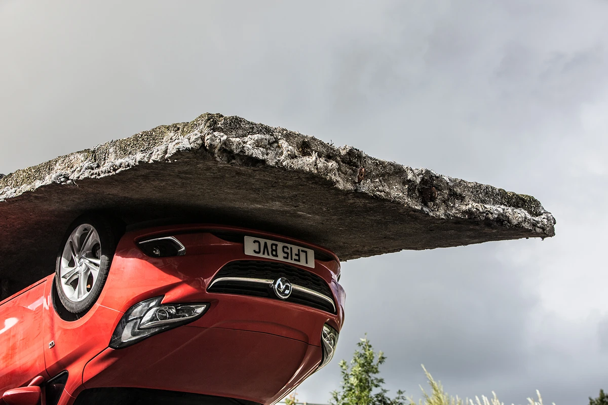 Pick yourself up and pull yourself together was a feat of structural engineering tearing up tarmac and supporting a car upside down