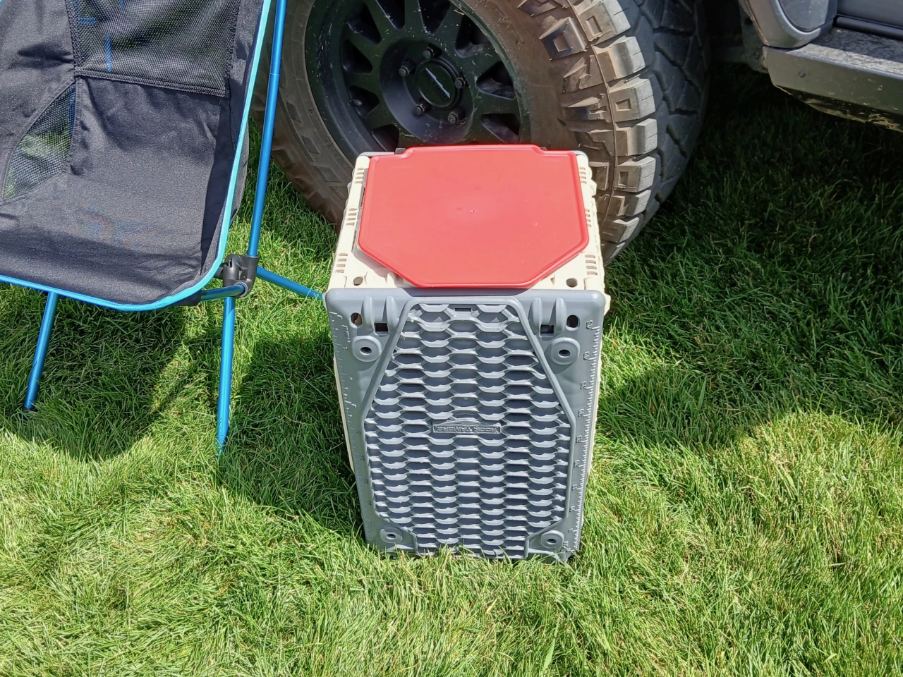 The Traction Crate as a side table or stool – the divider includes little nubs on the bottom that nest securely in the crate holes to keep it from sliding around