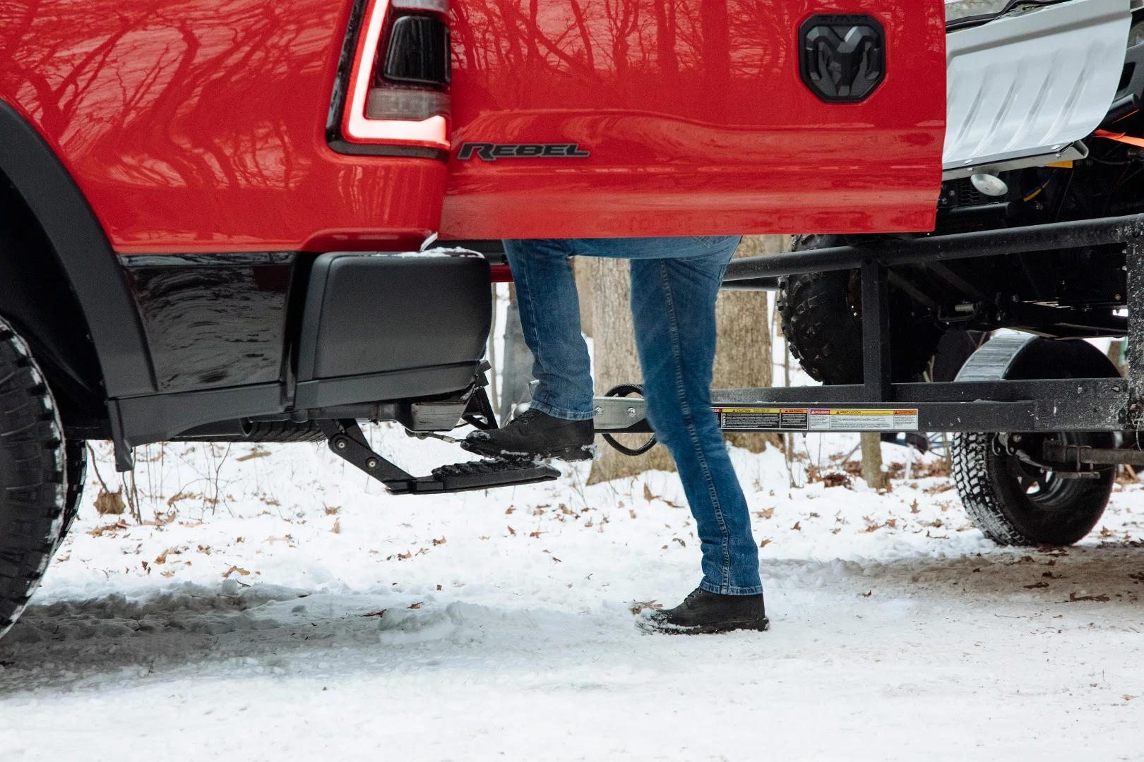 A new rear drop-down step comes from under the rear bumper to allow someone to more easily step into the Ram's truck bed