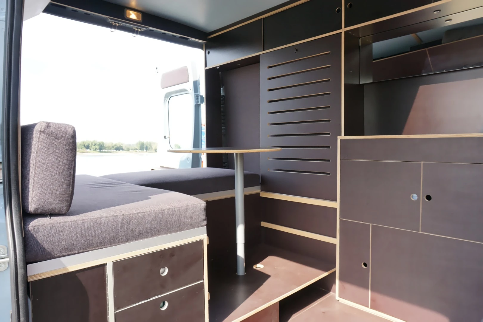 The interior carpentry is made using European birch plywood and features loads of storage compartments