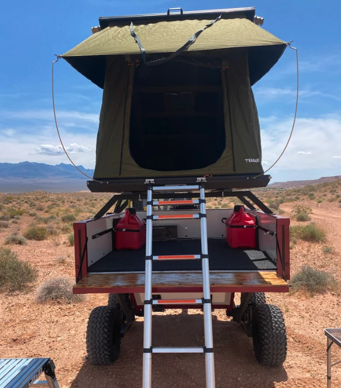 The Highcountry Unlimited trailer includes a pickup truck-like bed with drop-down tailgate and an under-bed storage tub