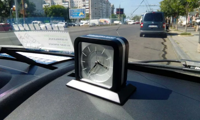 The Snoozle alarm clock on its base