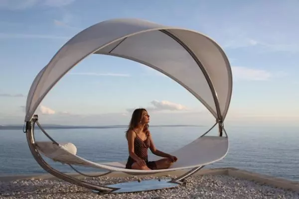 Surf lounge is suspended in mid-air, offering the comfort of traditional hammocks but with style