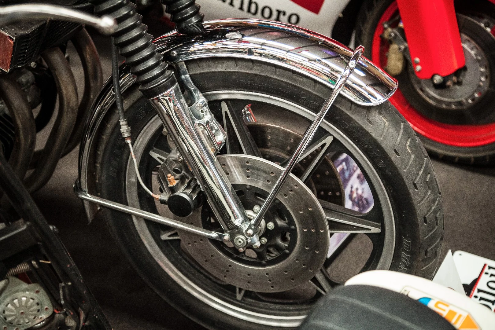 Honda four - showing brake and suspension customizations