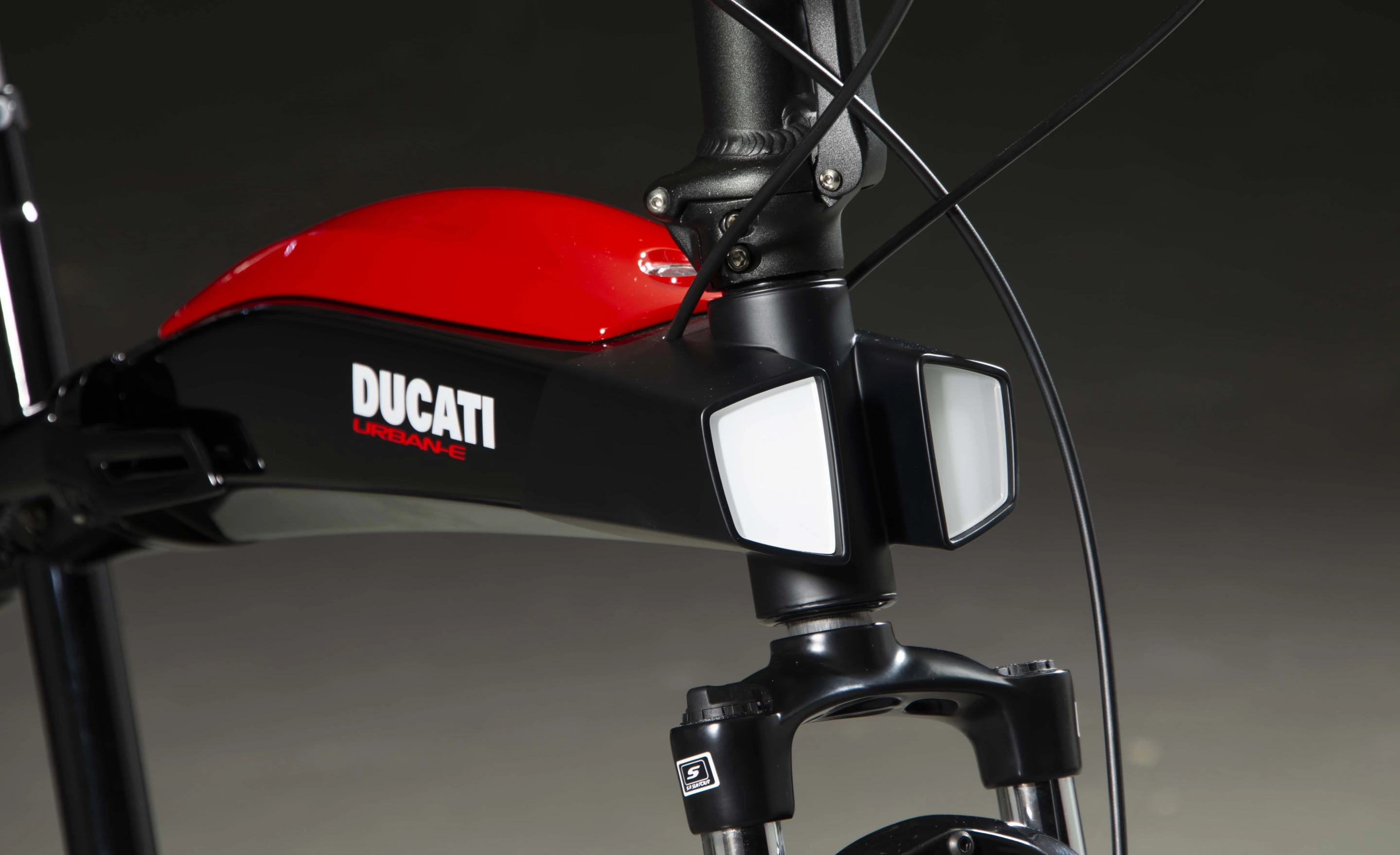 The Urban-E's gas tank-like battery compartment