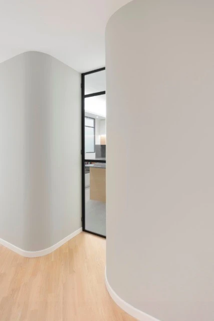 Glass doors allow natural light to filter through the home
