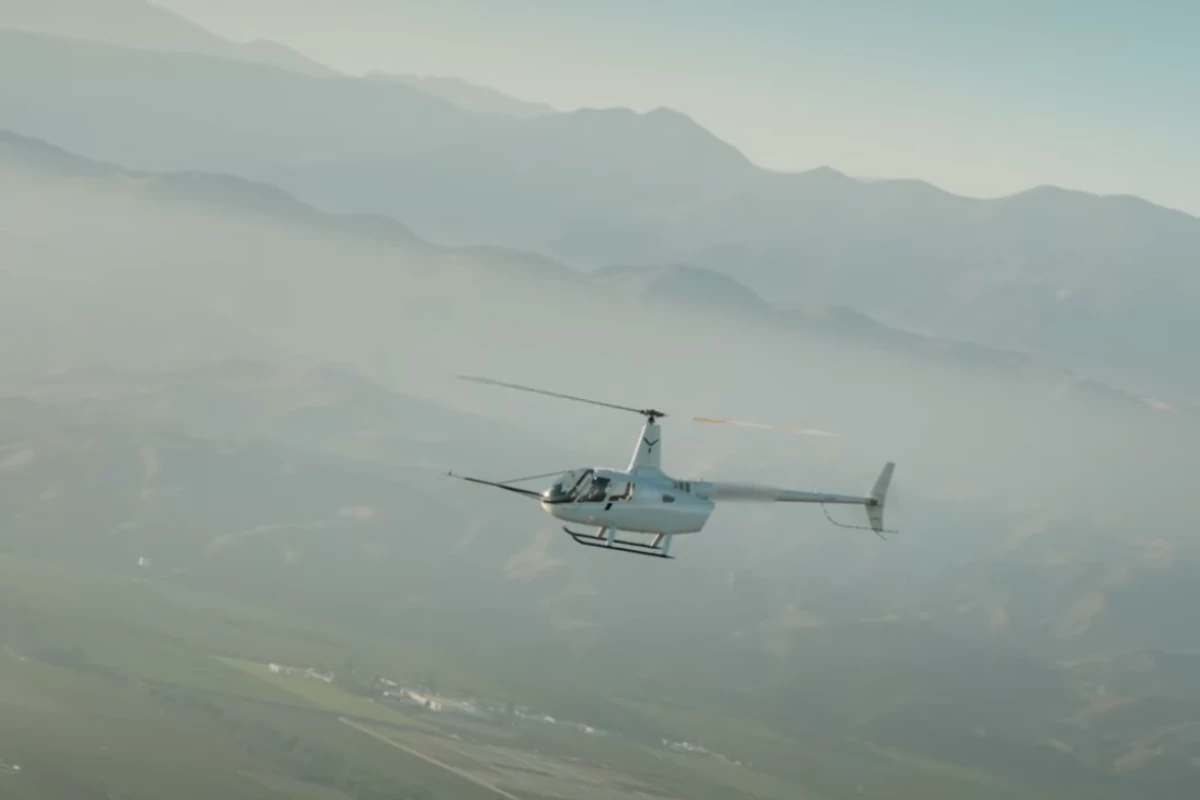 The Robinson R-66 begins to plummet in the world's first automated autorotation landing
