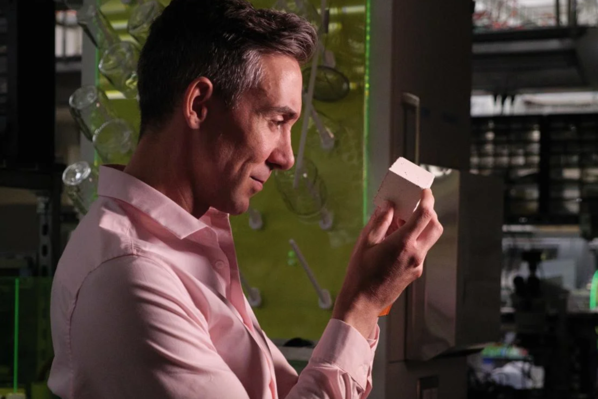 Material scientist Wil Srubar with a sample of concrete made using biogenic limestone