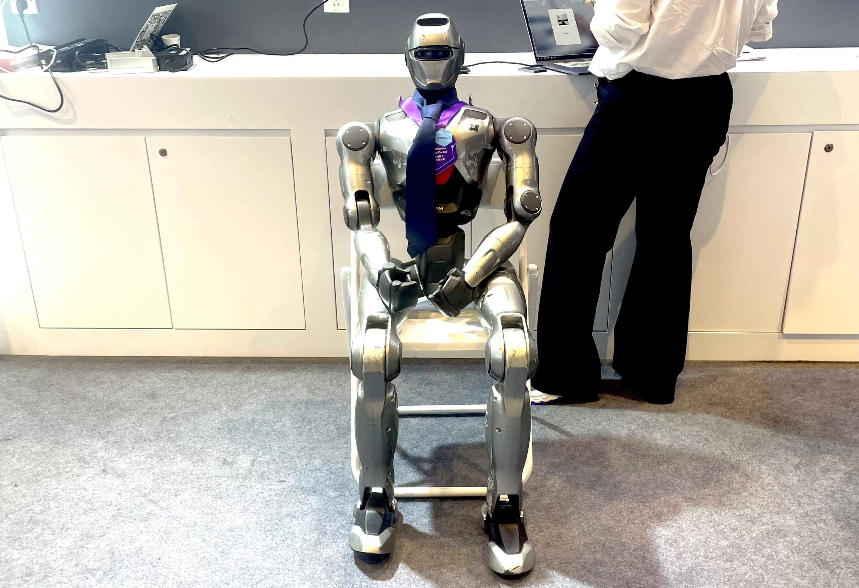Humanoid robot demonstrating advanced "energy management protocols" in the office