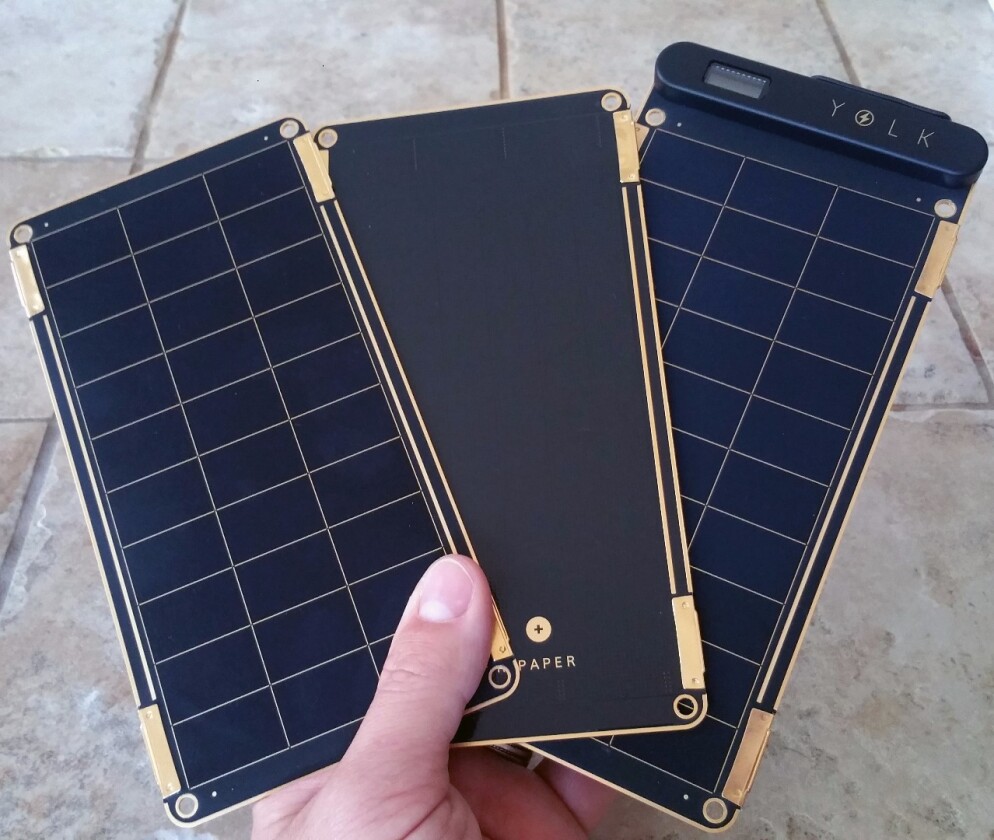 Solar Paper's matte black solar cells are gridded by gold accents, all of it left uncovered from any glass, plastic, or laminate