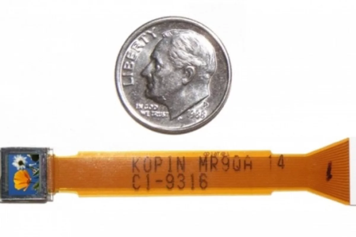 Kopin’s tiny CyberDisplay VGA display compared to the size of a U.S. dime