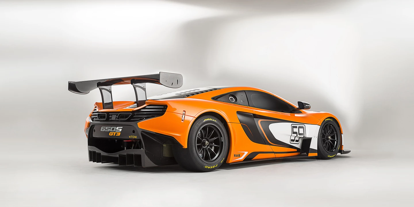 A massive carbon fiber rear wing provides downforce at high speed