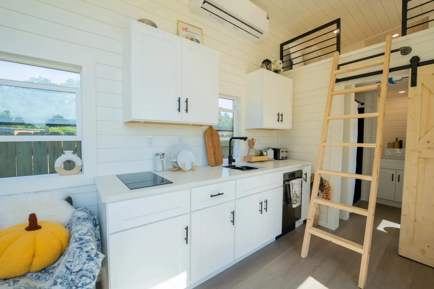 The Webster's kitchen has an oven, sink, induction cooktop, and space for more appliances