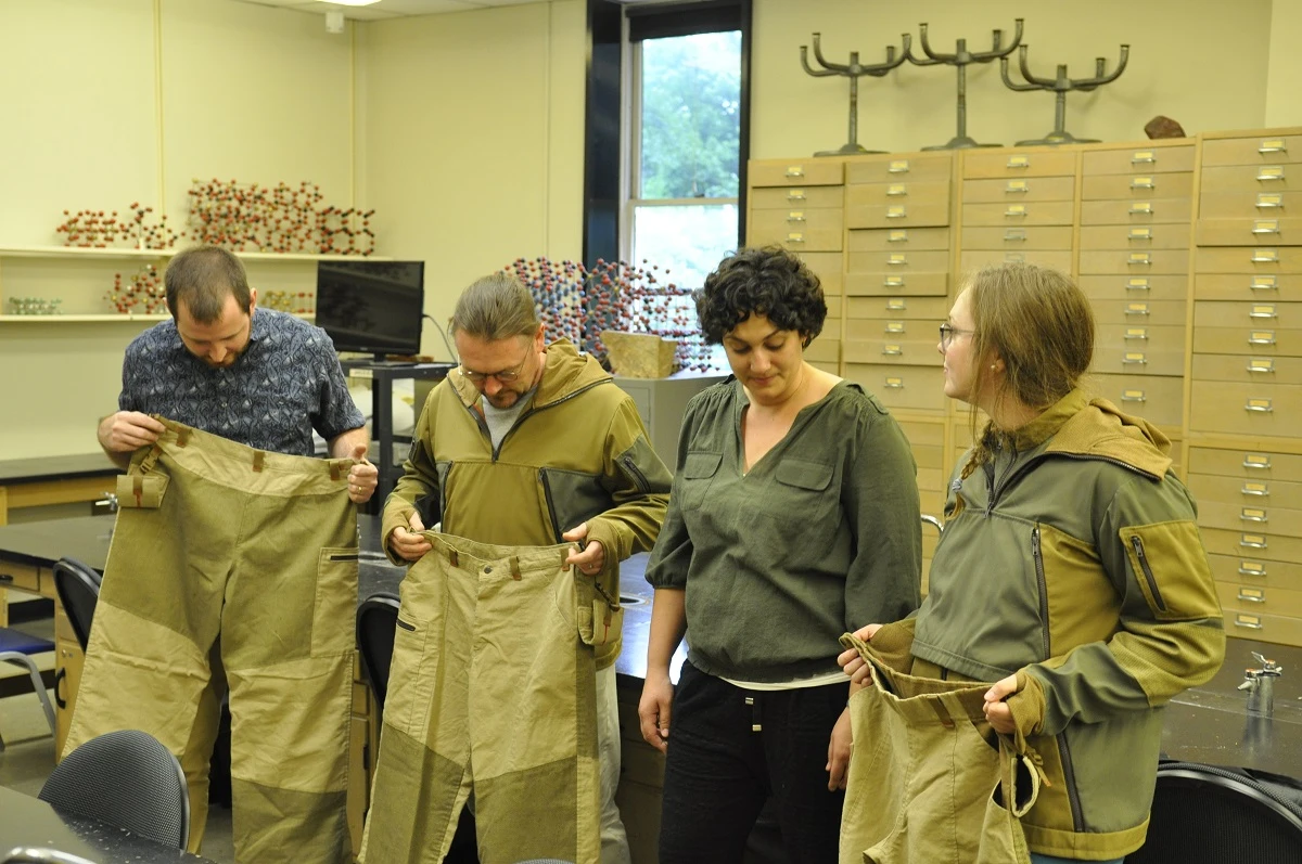 Abby Romine, pictured here with Stuart Kenderes, far left, Alan Whittington, second from left, and Emily Cunningham, far right, created prototype lava suits for Alan Whittington and his team of graduate students for their work as volcanologists