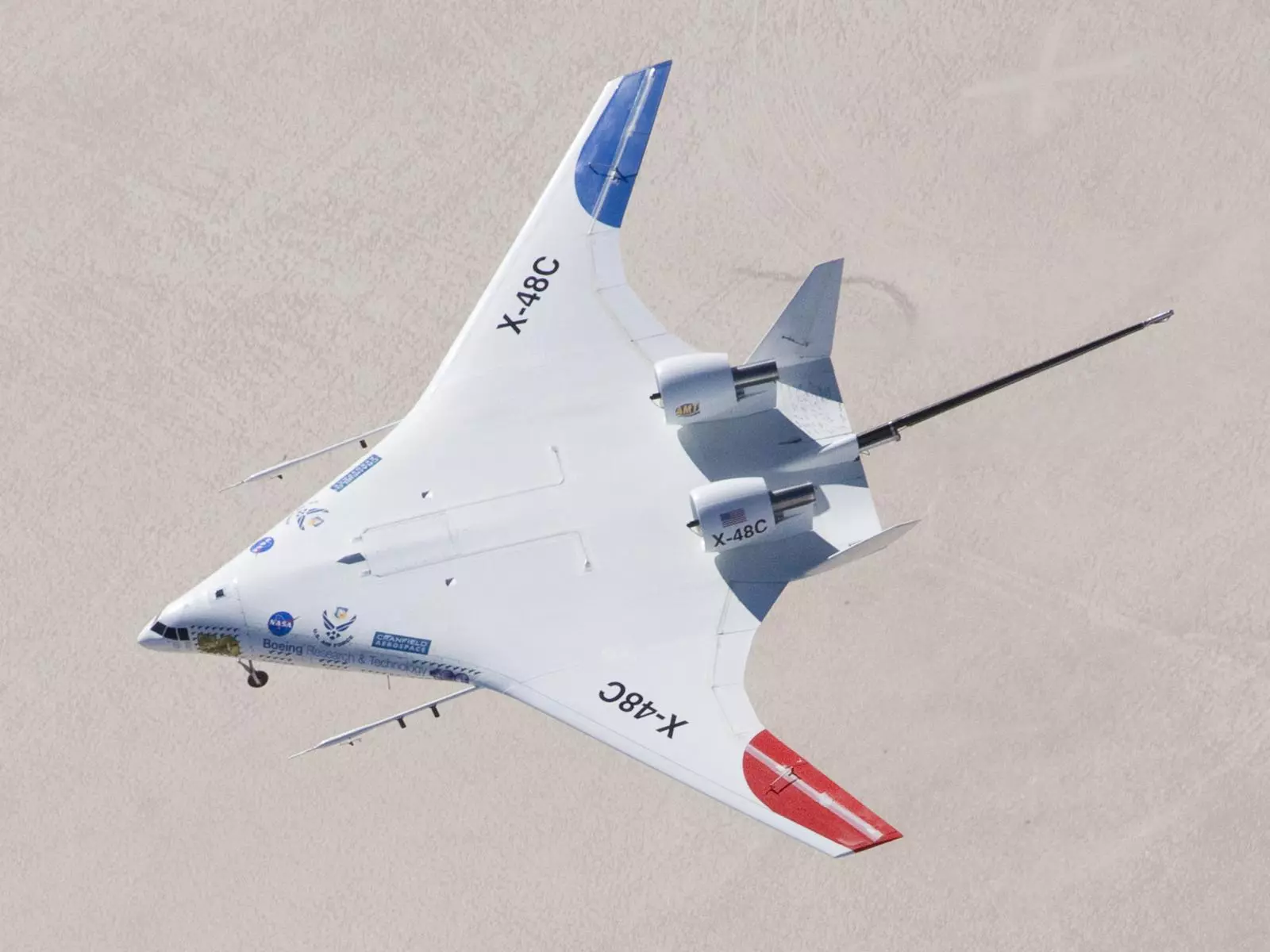 The X-48C Hybrid Wing Body aircraft flies over Rogers Dry Lake on Feb. 28, 2013 (Photo: NASA / Carla Thomas)