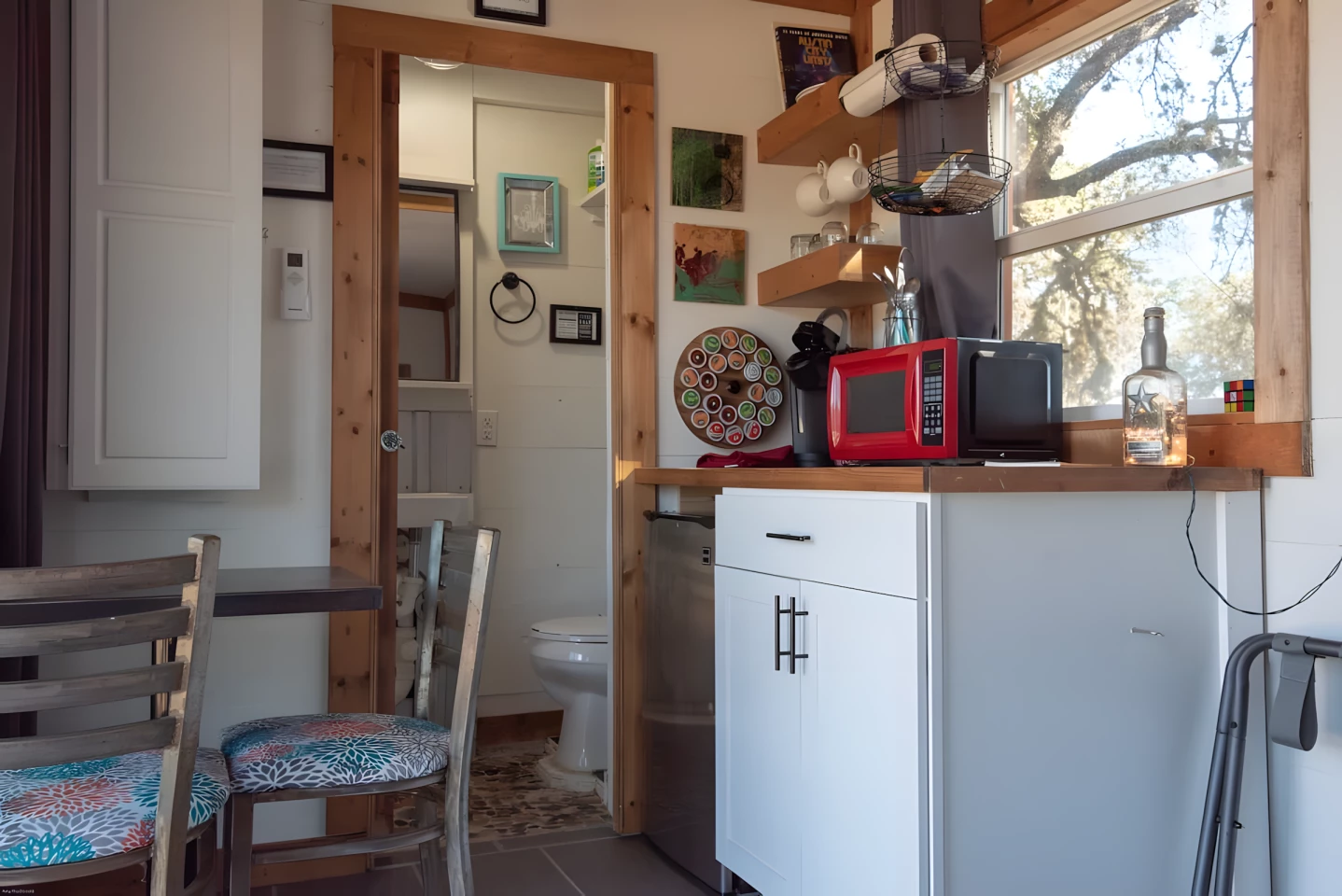 The Teeny Tiny Haus' kitchen is simple, reflecting its use as a vacation home