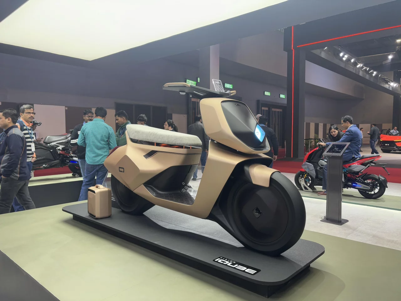 The TVS Vision iQube concept sports a boxy form, unique apron, and a sleek handlebar