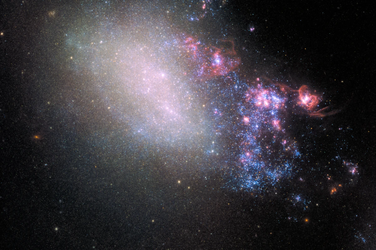 The galaxy NGC 4485 appears normal on the left side, but on the right it bears the stunning scars of a close encounter with another galaxy, in the form of a new star forming region