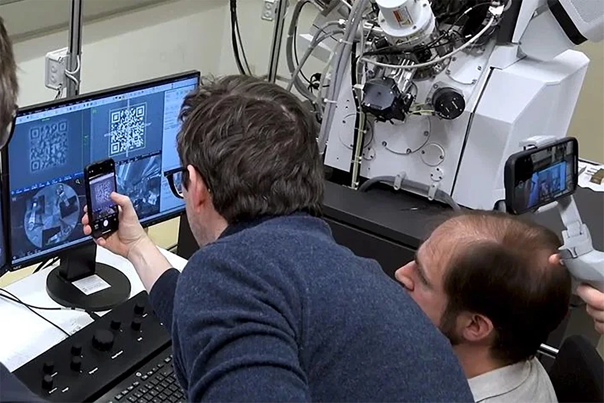 The TU Wien team in Vienna testing the QR code, viewed using an electron microscope