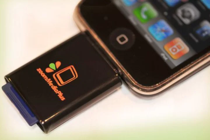 The zoomIt dongle connects to an iPhone or iPod Touch via the dock connector