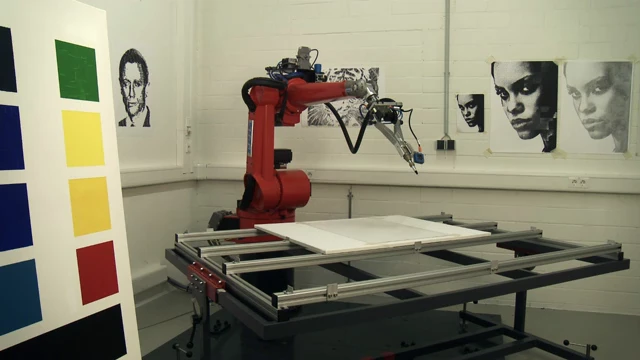 The eDavid system consists of a camera, a modified industrial welding robot arm, various paints and brushes, and computer software