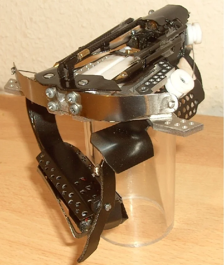 Hobbyist Patrick Priebe's latest creation is a wrist-mounted laser-sighted mini crossbow
