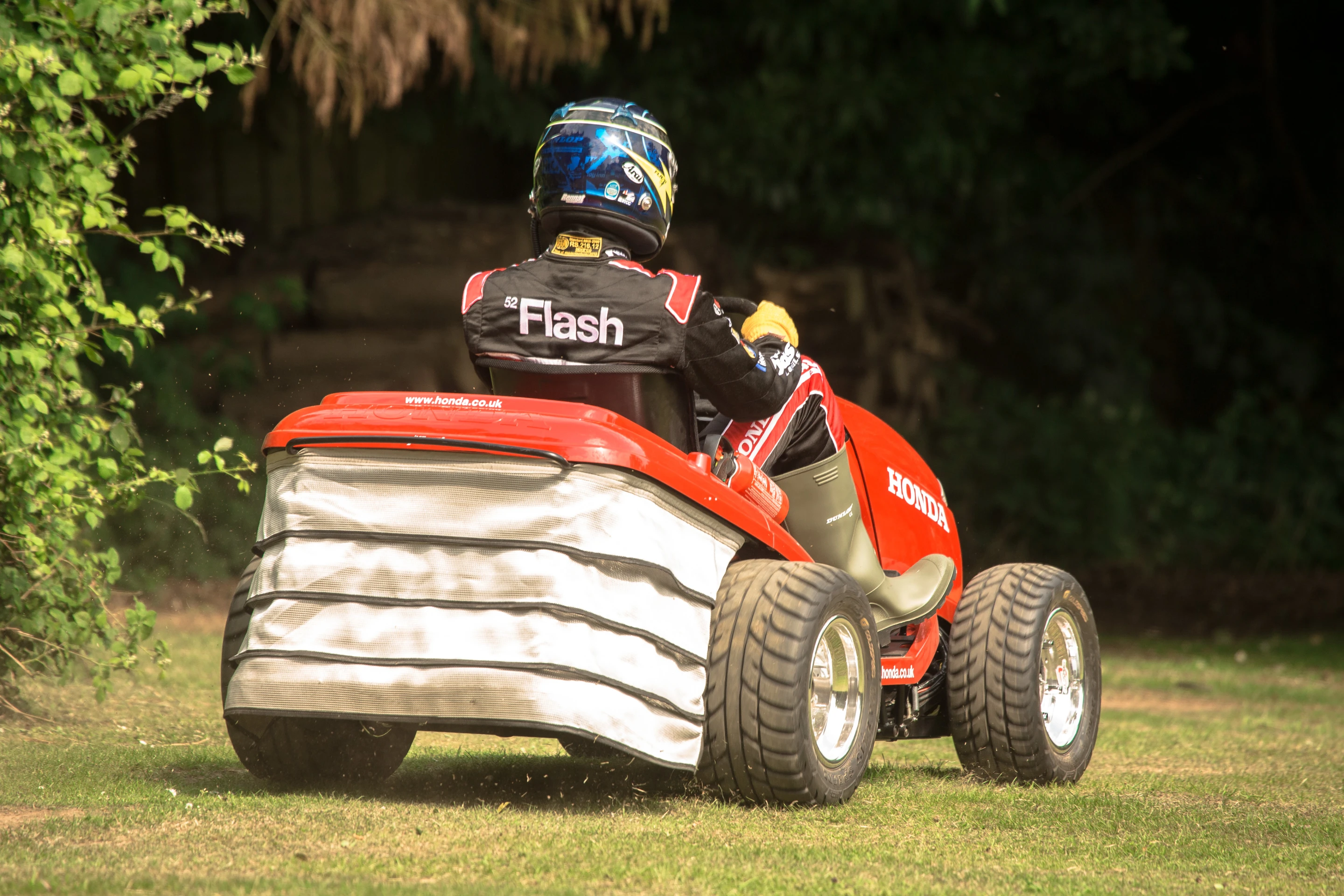 Pseudo grass-bag out back is actually hides the gas tank, oil cooler and secondary radiator