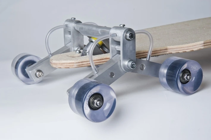The STAIR ROVER has eight wheels, mounted two-per-side on a pair of trucks that pivot to follow the contours of the stairs