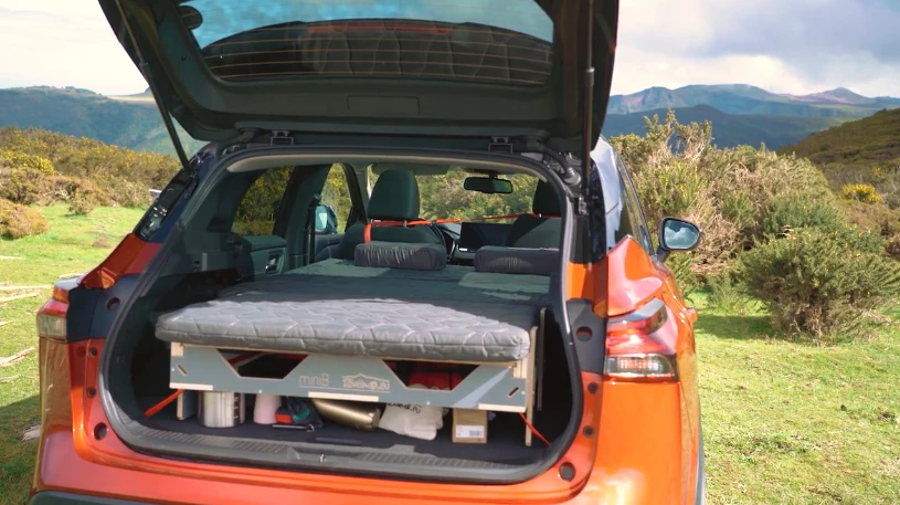 The MiniB kit travels by plane, train, donkey or other means, then sets up in your choice of hatchback vehicles to create an impromptu camper car