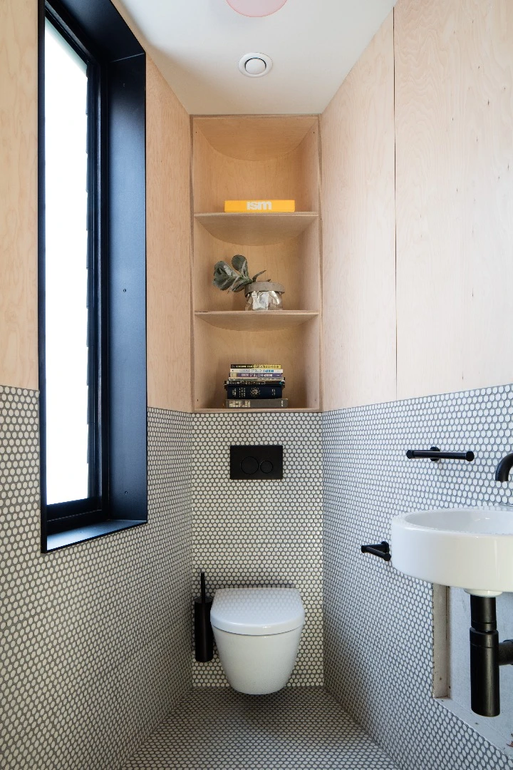 The master bedroom in the Acute House boasts an ensuite
