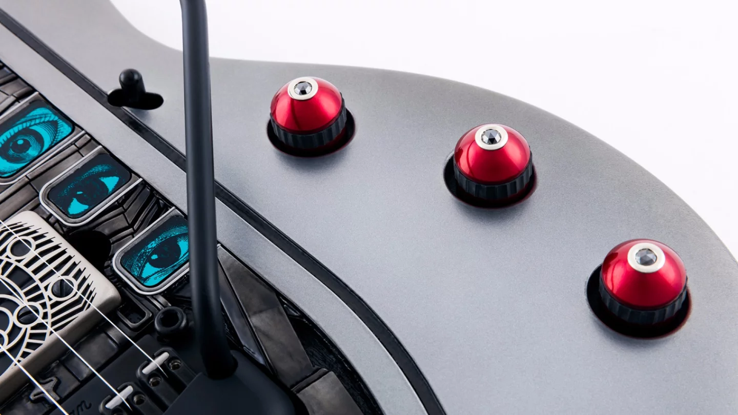 Each of the red anodized aluminum tone/volume knobs on the Nomac Majesty has been topped with a rose cut black diamond set in 14 karat white gold