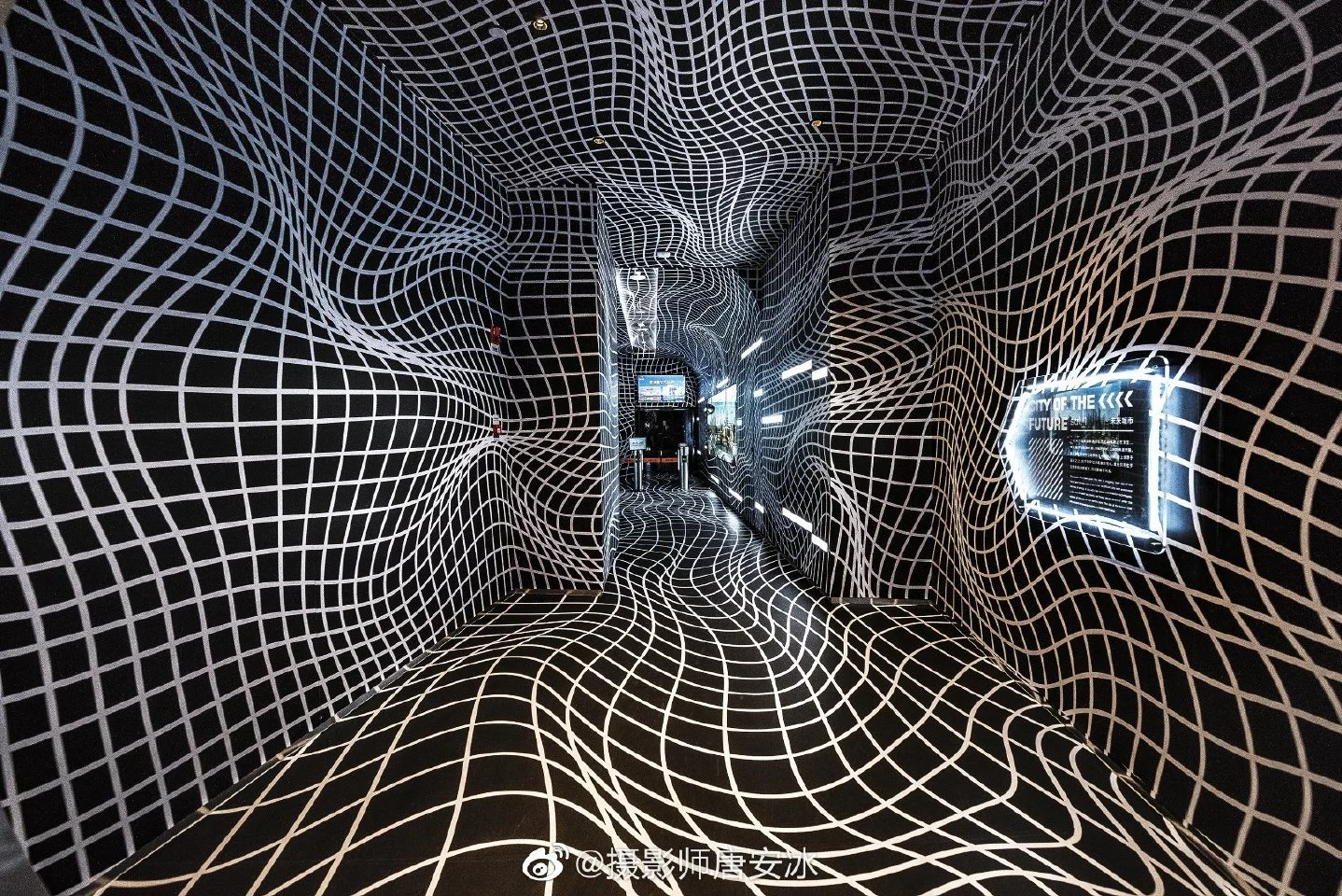 Visitors to the Crystal reach the elevator by passing through a corridor that plays with optical illusions