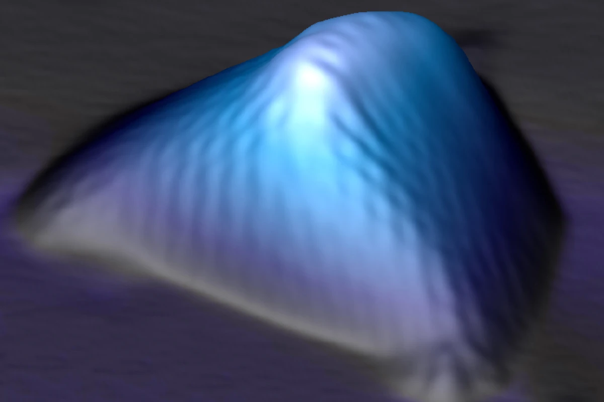 Scanning tunneling microscopy image of a graphene nanobubble, where the hexagonal two-dimensional graphene crystal is seen distorted and stretched along three main axes, creating pseudo-magnetic fields far stronger than any magnetic field ever produced in the laboratory