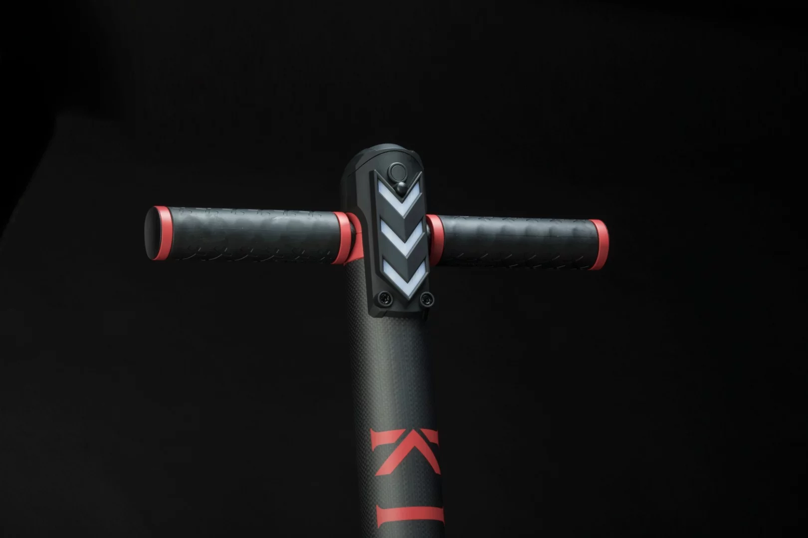 The KO1+ has LED lighting top front and bottom back, an LCD display shows battery status, speed and trip info, and its batteries are stowed away inside the handlebar downtube