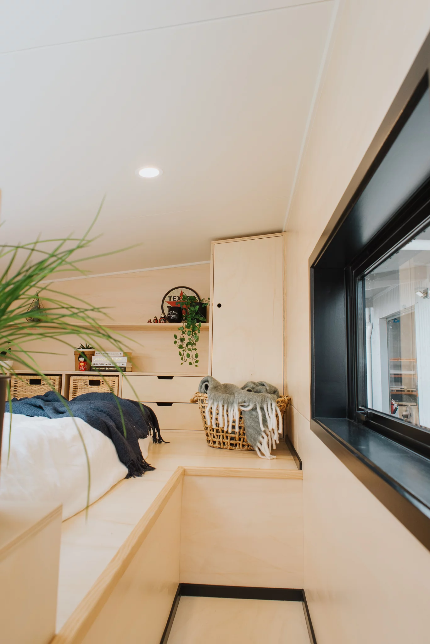 The Daisy Vera Tiny House's bedroom has a lowered platform to make it easier to get dressed