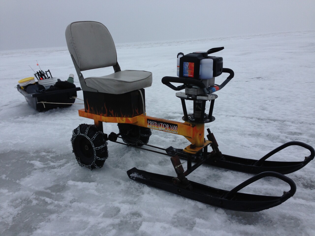 Icefishing gokart borrows the motor of its user's ice auger