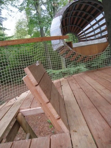 Climb the ladder and enter through the trap door