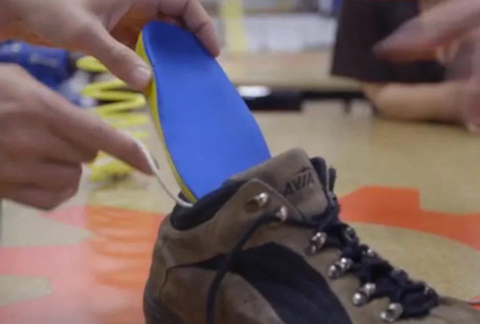 The SolePower insole being placed in a boot