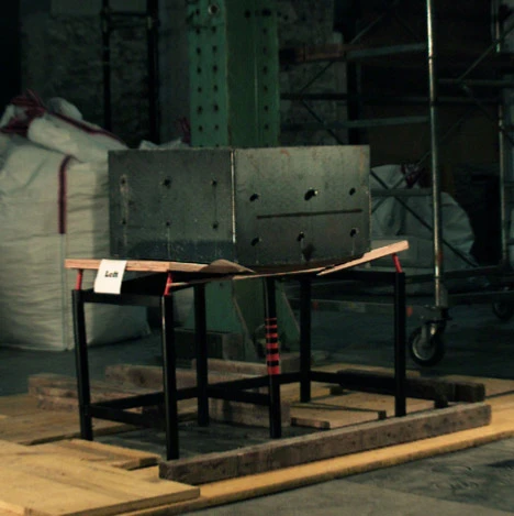 The desk was submitted to a battery of tests by having different materials of different weights dropped on it from a height