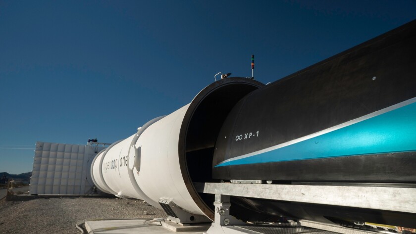 The prototype travel pod being loaded into the test cylinder
