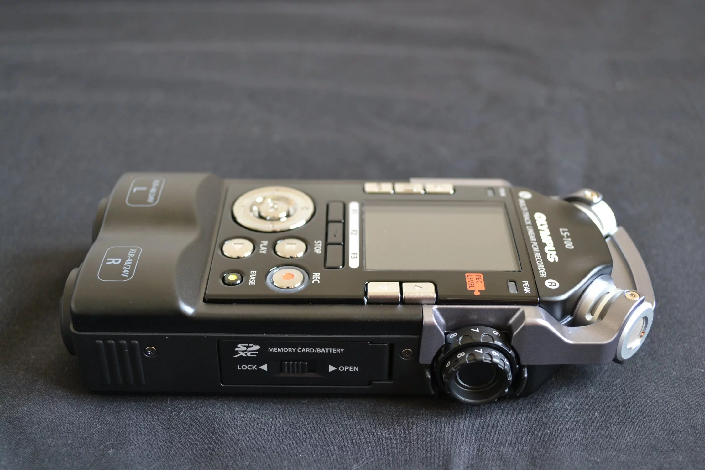 On the right, the battery compartment and SD card slot, and dual dials which offer independent control of the left and right recording levels