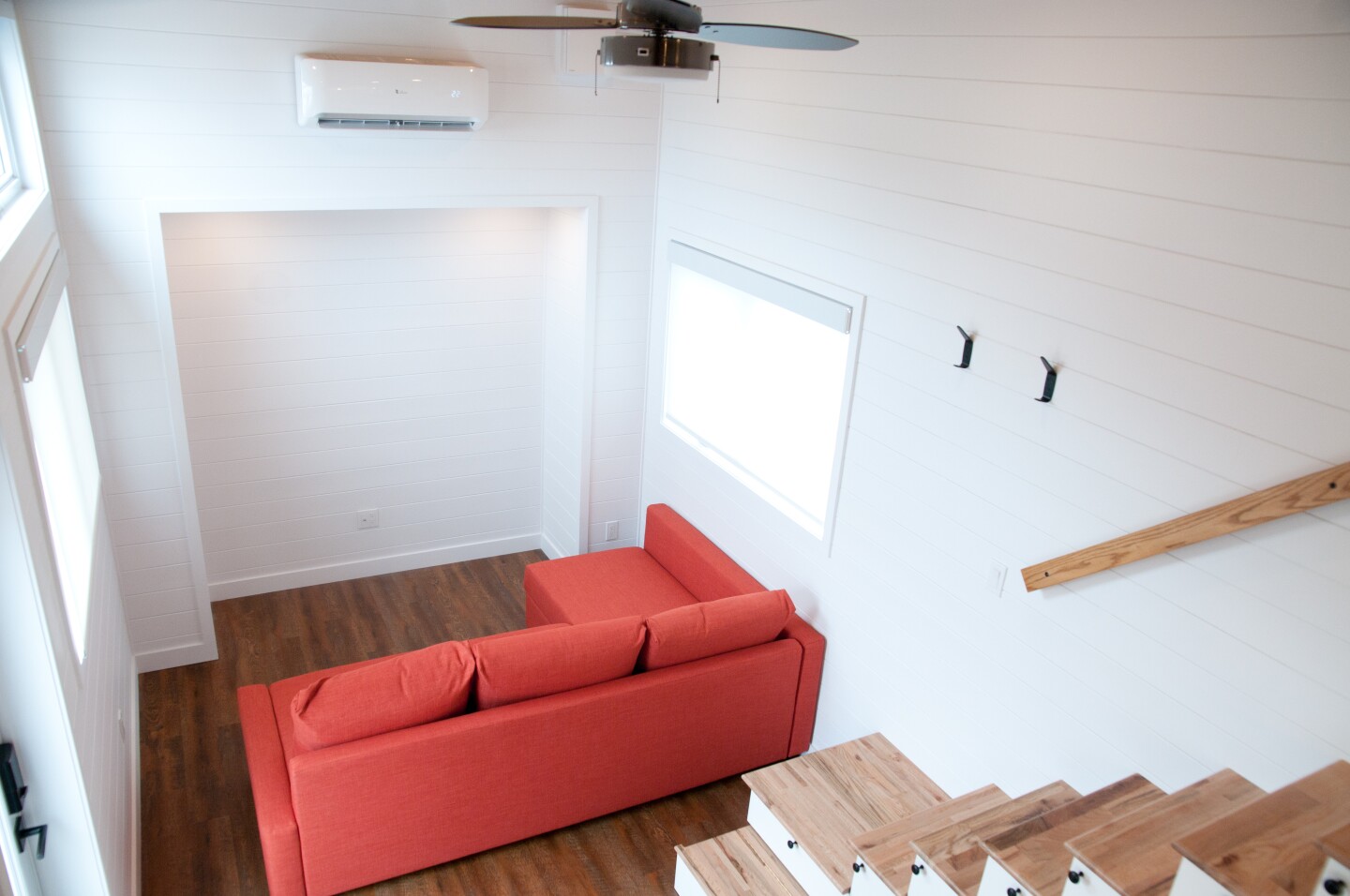 The Thuya's living room includes a large L-shaped sofa bed